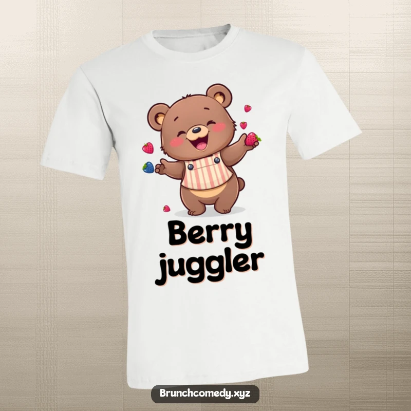 A happy bear wearing an apron is pictured enthusiastically juggling berries on this funny t-shirt.