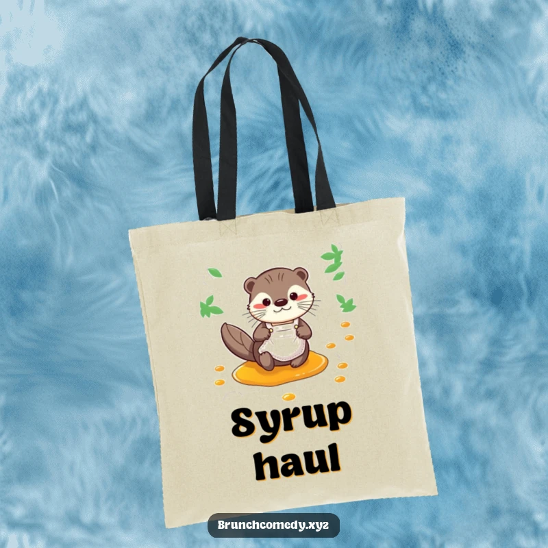Funny otter wearing an apron sliding down a syrup stream on a tote bag, perfect for breakfast runs.